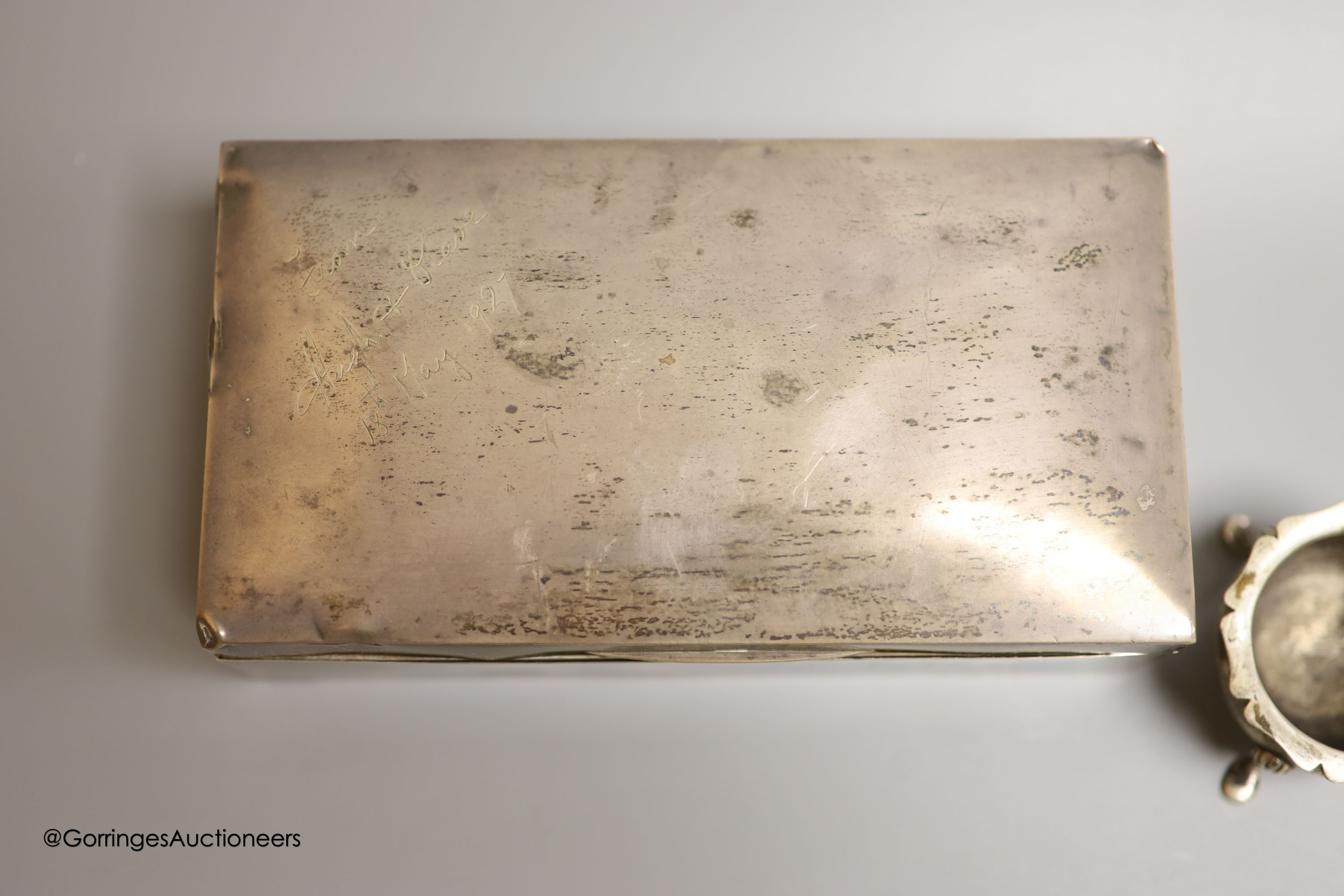 A George V silver rectangular cigarette box, Birmingham, 1926,16.5cm, a silver christening mug and a silver salt.
